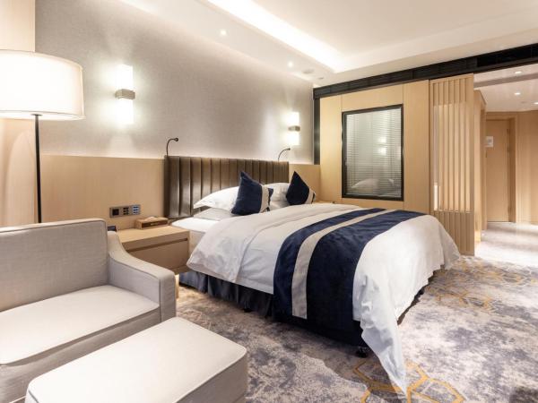 Chongqing Liyuan Hotel : photo 5 de la chambre chambre lit king-size de luxe - vue sur ville - fumeurs