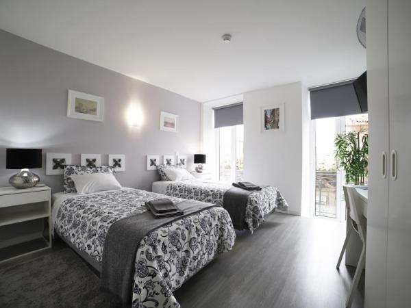 Guest House Triunfo : photo 4 de la chambre chambre lits jumeaux