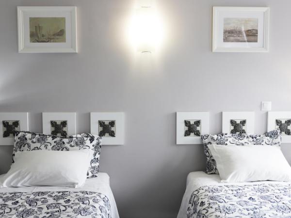 Guest House Triunfo : photo 9 de la chambre chambre lits jumeaux