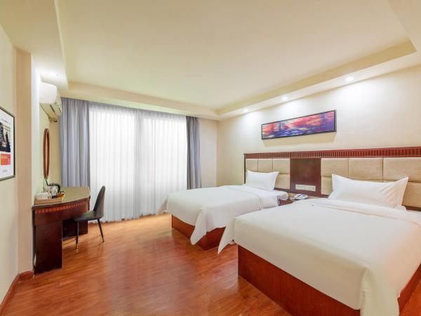 Huahang Hotel - Guangzhou Baiyun International Airport - Free airport shuttle bus : photo 4 de la chambre chambre lits jumeaux spacieuse
