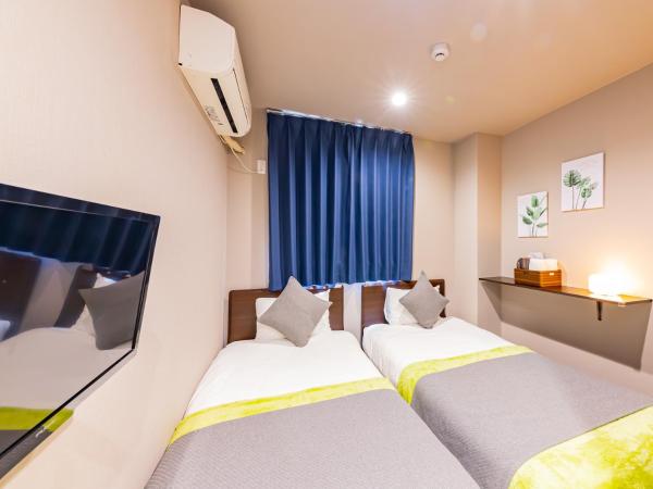 JA Hotel Shinfukae 新深江 : photo 1 de la chambre chambre double ou lits jumeaux avec salle de bains