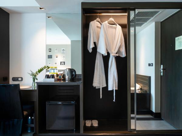 Golden Tulip Mandison Suites : photo 3 de la chambre grande chambre lit king-size deluxe