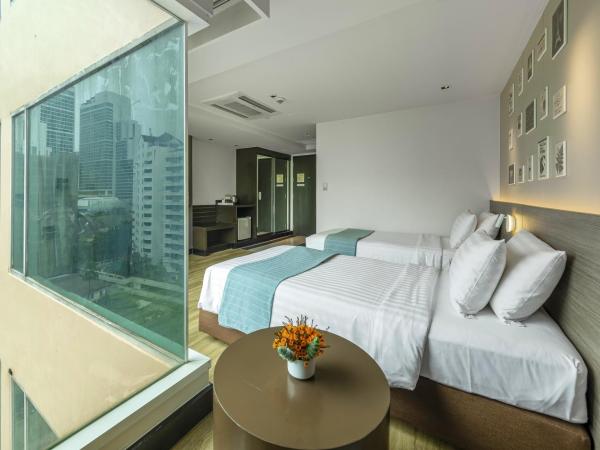 Golden Tulip Mandison Suites : photo 2 de la chambre chambre lits jumeaux deluxe