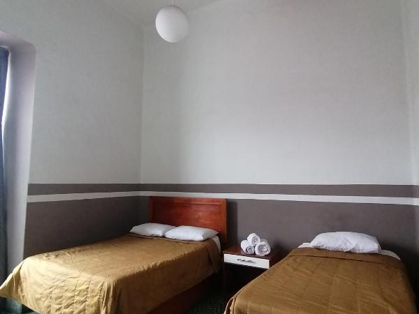 Casa Veeyuu : photo 1 de la chambre chambre triple avec balcon