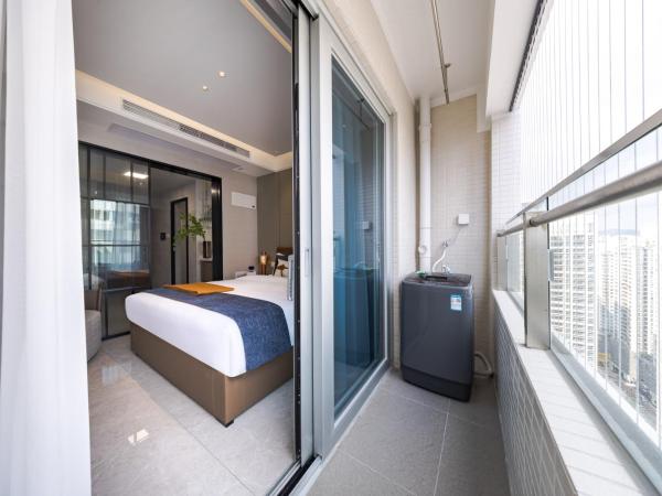 Xi Ke Executive Apartment - Shenzhen Futian Exhibition Center : photo 6 de la chambre chambre lit king-size - vue sur ville
