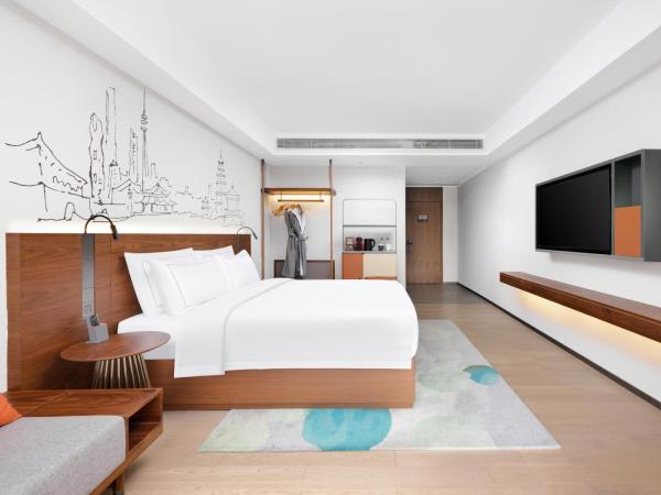 UrCove Xi'an Hi-Tech Software Park : photo 1 de la chambre chambre lit king-size exécutive