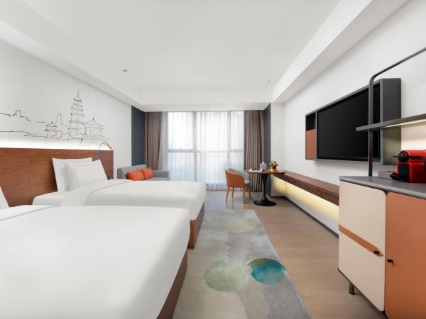 UrCove Xi'an Hi-Tech Software Park : photo 2 de la chambre chambre lits jumeaux exécutive