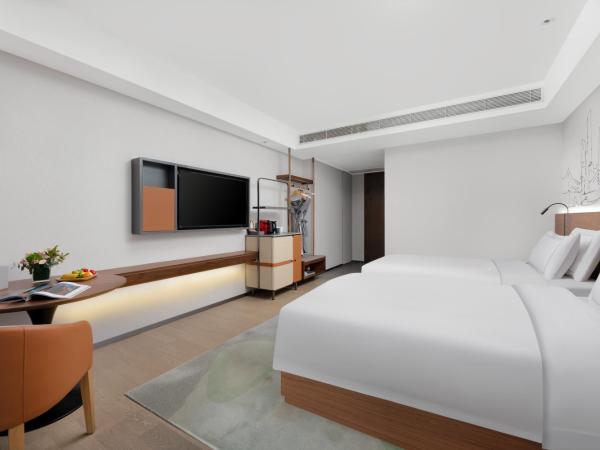 UrCove Xi'an Hi-Tech Software Park : photo 1 de la chambre chambre lits jumeaux exécutive