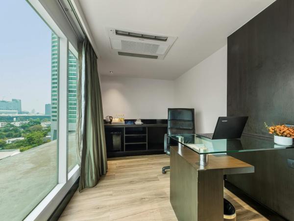 Golden Tulip Mandison Suites : photo 4 de la chambre suite lit king-size exécutive