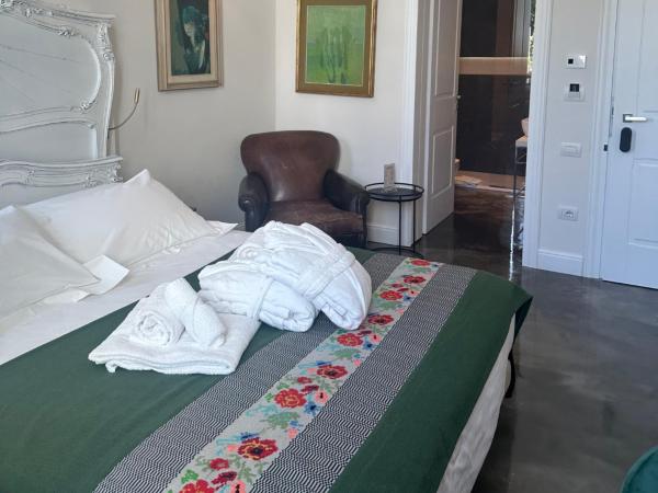 Kemani Villa Sara Olbia : photo 2 de la chambre chambre double deluxe (2 adultes + 1 enfant)
