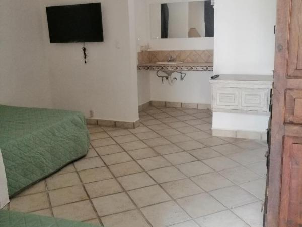 Majaguar : photo 9 de la chambre chambre double ou lits jumeaux avec salle de bains privative