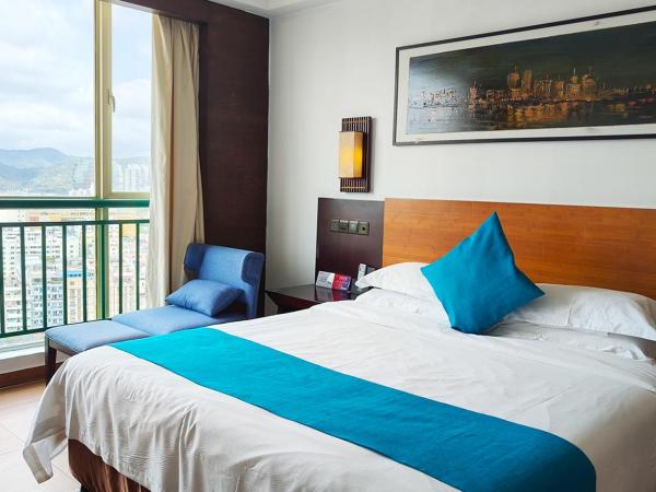 Shengyi Holiday Villa Hotel : photo 2 de la chambre chambre lit king-size - vue sur ville