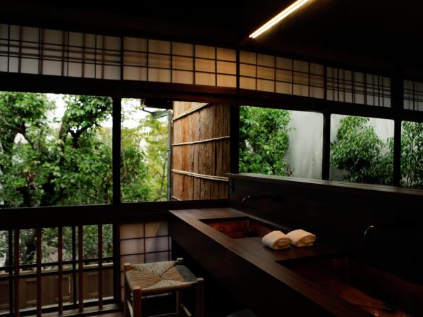 Sowaka : photo 5 de la chambre chambre lits jumeaux deluxe - mur naguri (bâtiment principal)