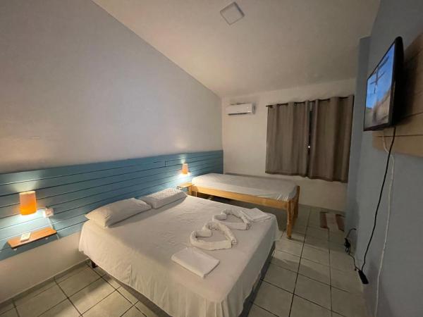 Pousada Encanto dos Mares : photo 3 de la chambre chambre triple supérieure