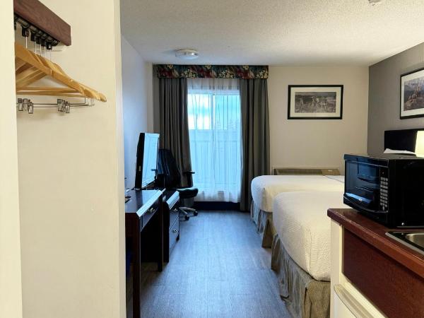 Divya Sutra Plaza and Conference Centre Calgary Airport : photo 8 de la chambre chambre double standard avec 1 lit queen-size 