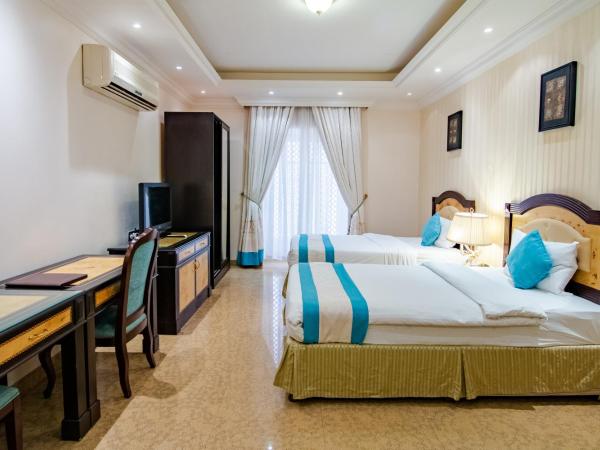 Garden Hotel Muscat By Royal Titan Group : photo 3 de la chambre suite lits jumeaux