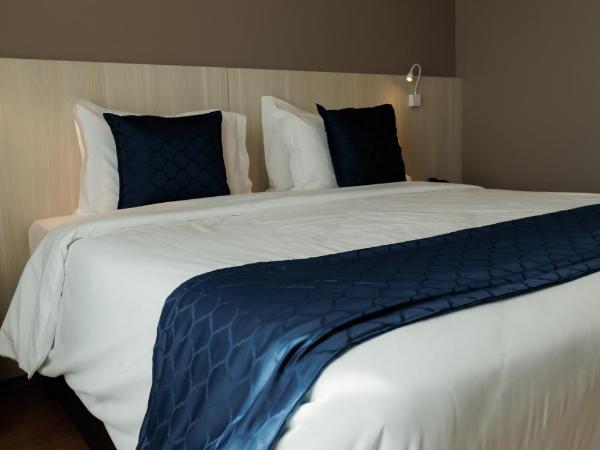 eSuites Belo Horizonte Minascasa : photo 8 de la chambre chambre lit queen-size deluxe