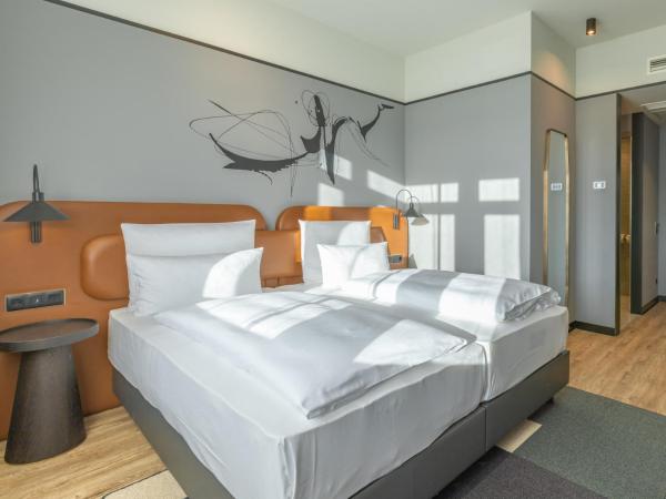 TITANIC Comfort Kurfürstendamm : photo 1 de la chambre chambre lits jumeaux affaires triple