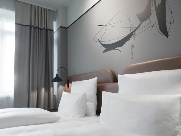 TITANIC Comfort Kurfürstendamm : photo 2 de la chambre chambre lits jumeaux affaires triple