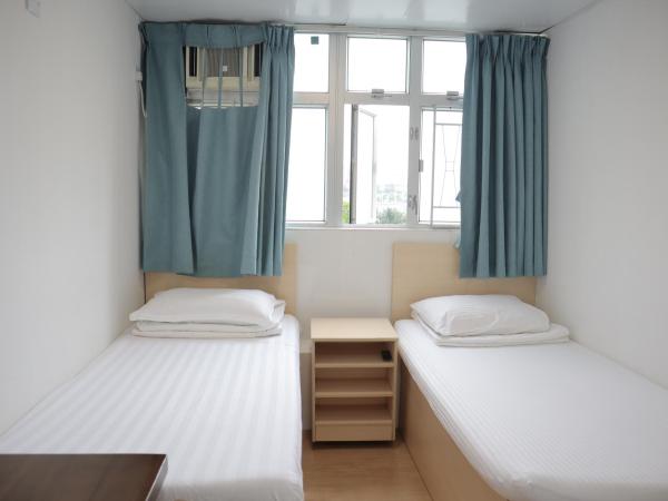 Hoi To Hostel : photo 1 de la chambre chambre lits jumeaux