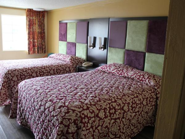 Executive Inn & Suites : photo 2 de la chambre chambre double deluxe (2 adultes + 1 enfant)