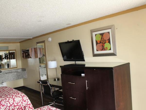 Executive Inn & Suites : photo 3 de la chambre chambre double deluxe (2 adultes + 1 enfant)