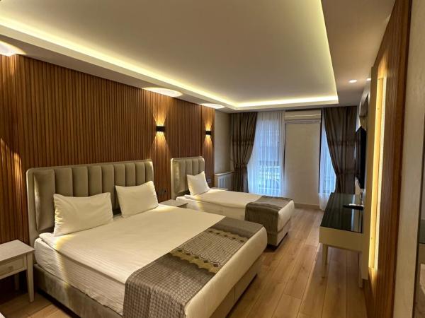 Kupeli Hotel : photo 1 de la chambre chambre triple deluxe