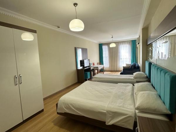 Kupeli Hotel : photo 2 de la chambre chambre quadruple de luxe - annexe