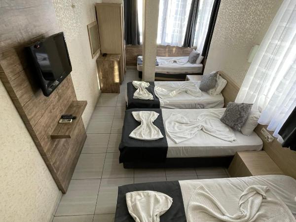 Denizhan Hotel : photo 5 de la chambre chambre quadruple avec salle de bains privative