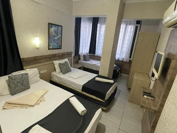 Denizhan Hotel : photo 6 de la chambre chambre quadruple avec salle de bains privative