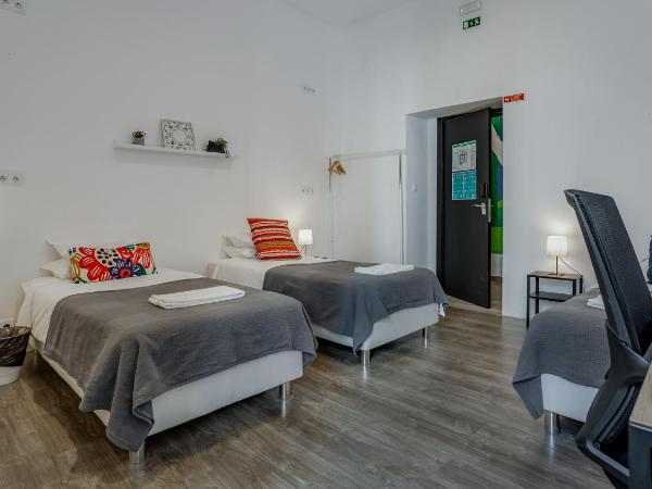 Hostellicious : photo 1 de la chambre chambre triple basique avec salle de bains commune