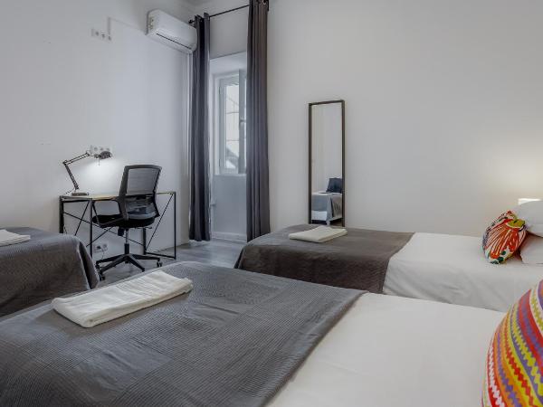 Hostellicious : photo 2 de la chambre chambre triple basique avec salle de bains commune