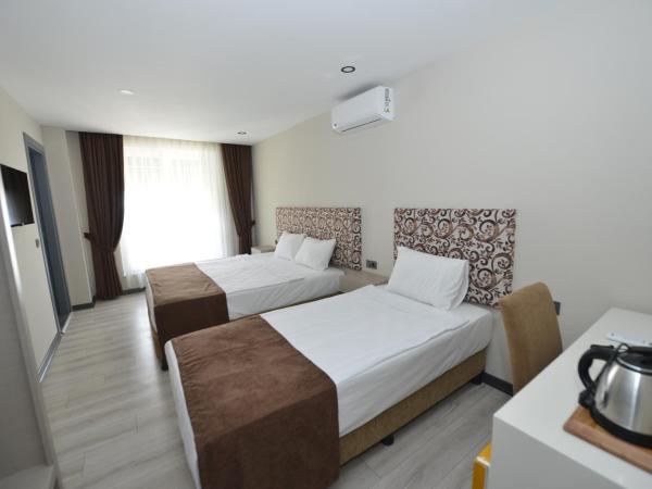 Toprak City Hotel Antalya : photo 1 de la chambre chambre triple - vue sur ville