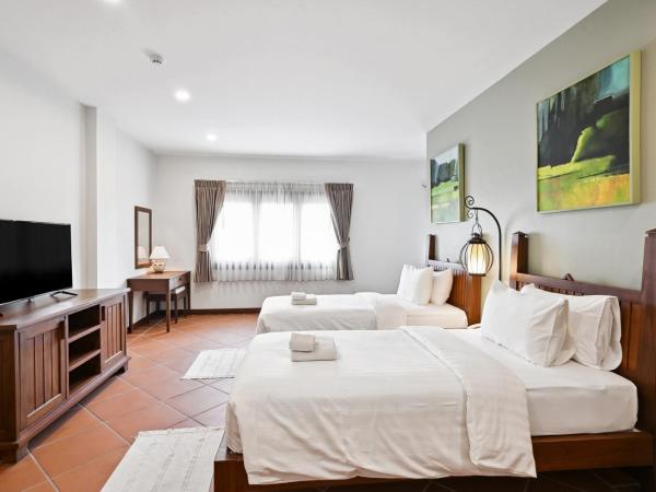 Villa Sanpakoi : photo 1 de la chambre chambre lits jumeaux - vue sur ville