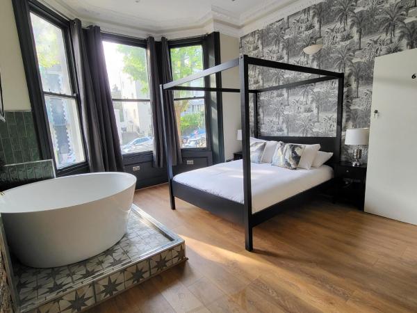 INNit Bliss : photo 2 de la chambre chambre double deluxe avec baignoire