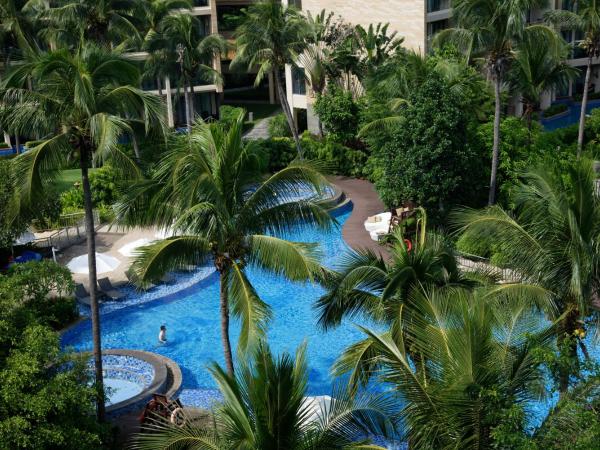Wanda Realm Resort Sanya Haitang Bay : photo 5 de la chambre chambre lit king-size avec vue sur le jardin
