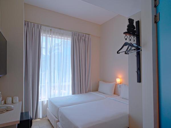 Cititel Express Kota Kinabalu : photo 2 de la chambre chambre lits jumeaux standard avec fenêtre