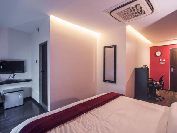 The V Sadan : photo 1 de la chambre chambre lit king-size