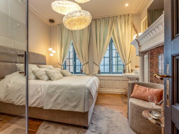 Castelsuites : photo 1 de la chambre chambre double deluxe avec douche