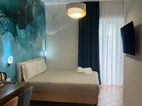 Le Corti del Re : photo 1 de la chambre chambre double ou lits jumeaux deluxe - vue sur ville