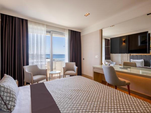 Porto Bello Hotel Resort & Spa : photo 1 de la chambre chambre double standard - vue latérale sur mer