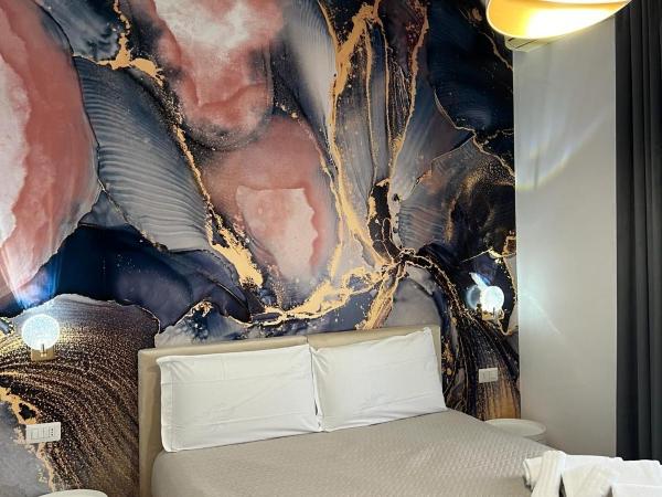 Le Corti del Re : photo 2 de la chambre chambre double ou lits jumeaux deluxe - vue sur ville