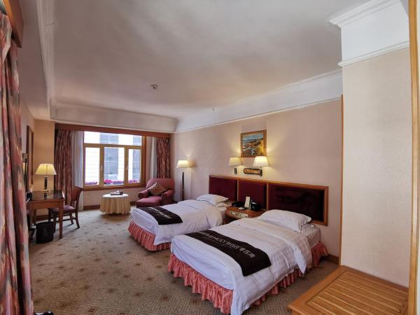 Qingdao Oceanwide Elite Hotel : photo 2 de la chambre chambre lits jumeaux d'affaires avec vue sur la ville