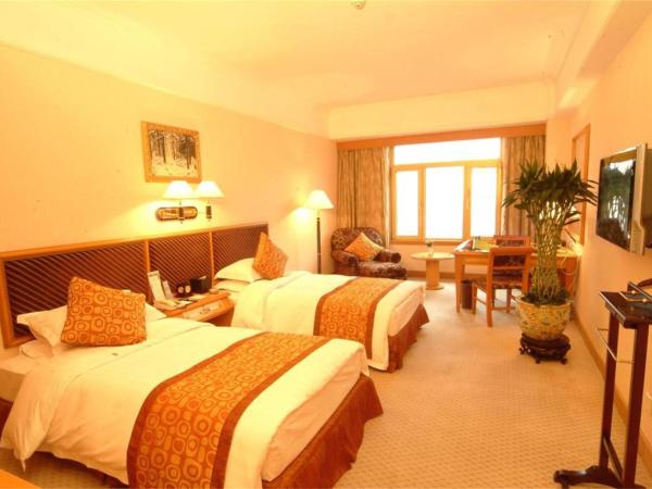 Qingdao Oceanwide Elite Hotel : photo 1 de la chambre chambre affaires lits jumeaux - vue sur mer