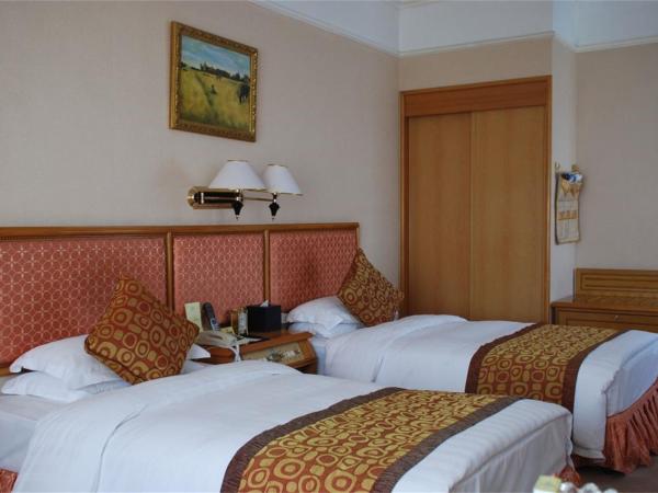 Qingdao Oceanwide Elite Hotel : photo 2 de la chambre chambre affaires lits jumeaux - vue sur mer