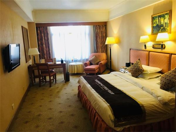 Qingdao Oceanwide Elite Hotel : photo 2 de la chambre chambre double affaires avec vue sur la ville