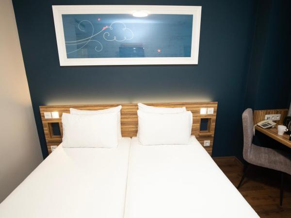 Travelodge Madrid Metropolitano : photo 6 de la chambre chambre lits jumeaux