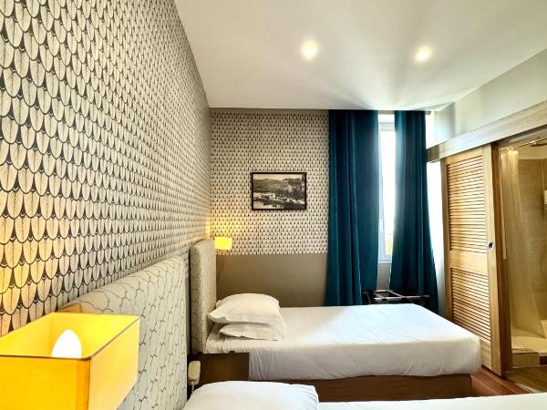 Hotel Restaurant Christophe Colomb : photo 3 de la chambre chambre lits jumeaux - vue sur mer