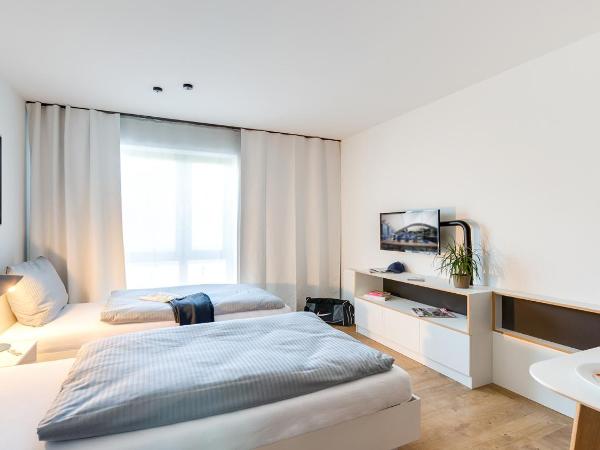 SMARTments business Frankfurt Airport : photo 4 de la chambre chambre lits jumeaux