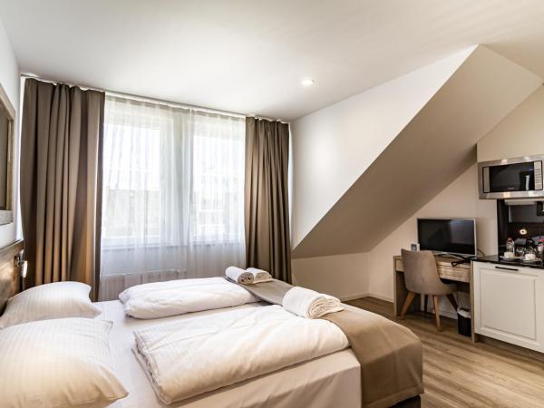 Sleep Inn Düsseldorf : photo 1 de la chambre chambre lit king-size deluxe